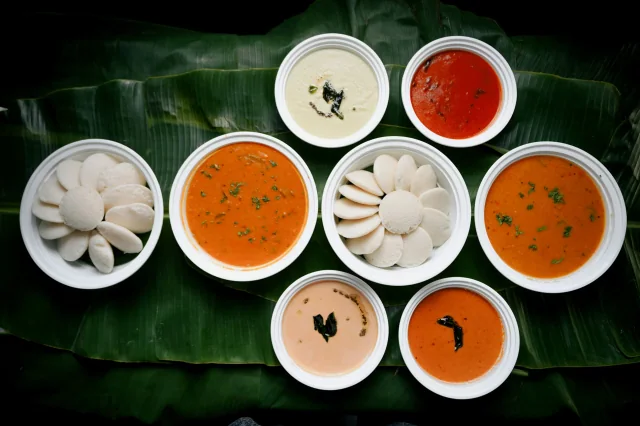 Plain steamed idli with sambar and chutneys